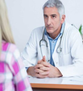 doctor speaking to patient
